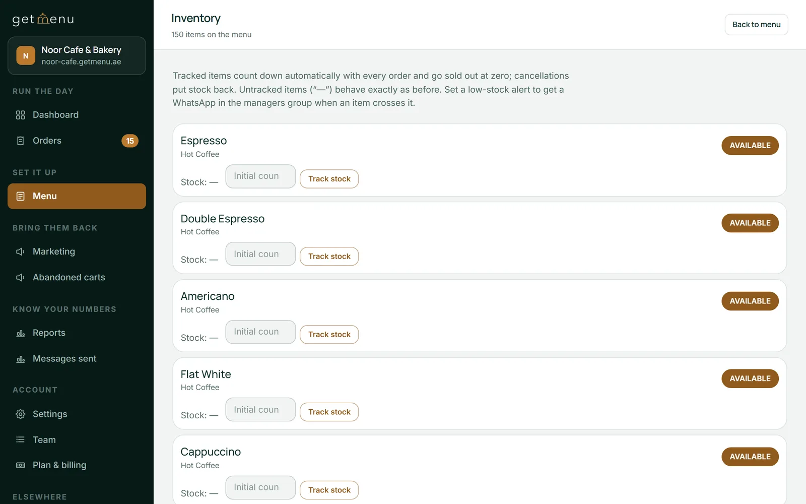 The GetMenu dashboard's Inventory page for Noor Cafe & Bakery, the demo restaurant: 150 items on the menu, a note that tracked items count down with every order and go sold out at zero, and coffee items, each with a stock line, a box for the first count, a Track stock button and an Available badge.