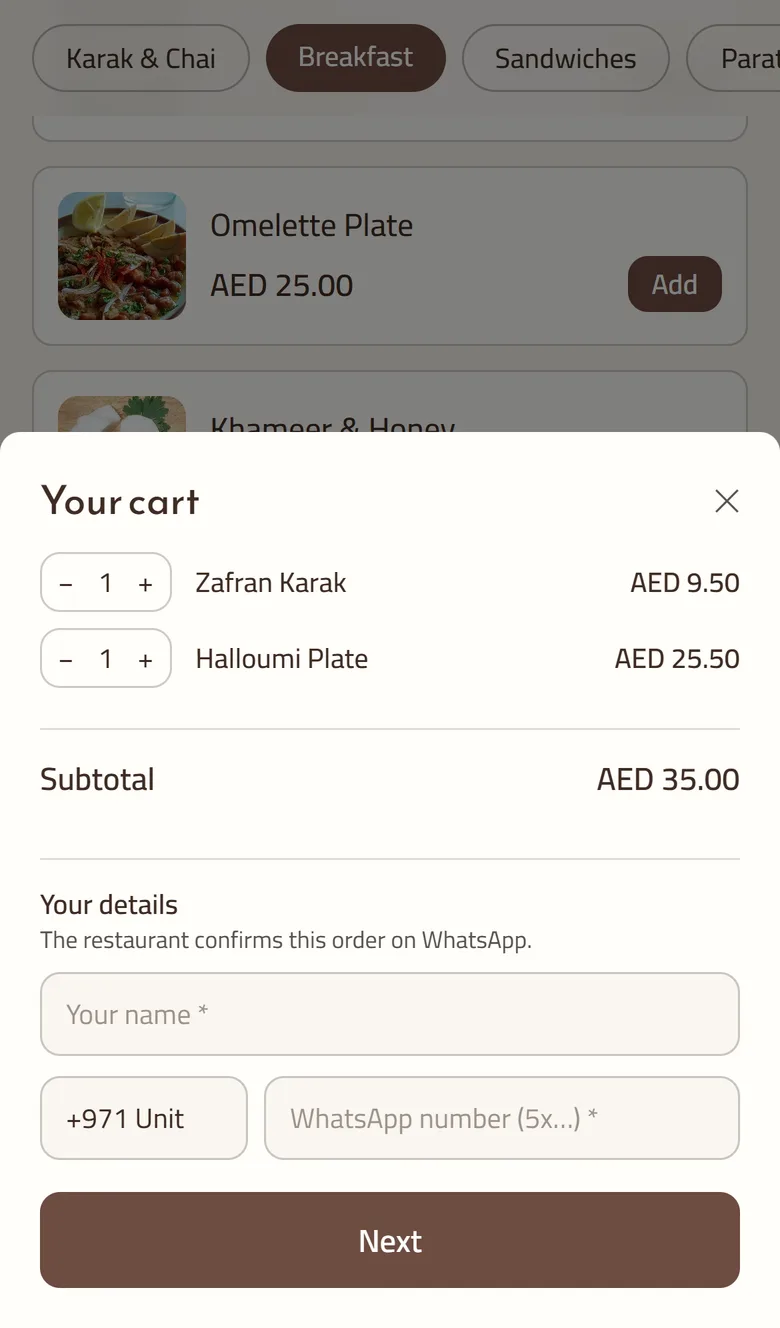 The cart on a GetMenu ordering page on a phone, with two dishes, the subtotal, boxes for the customer's name and WhatsApp number, and a Next button.
