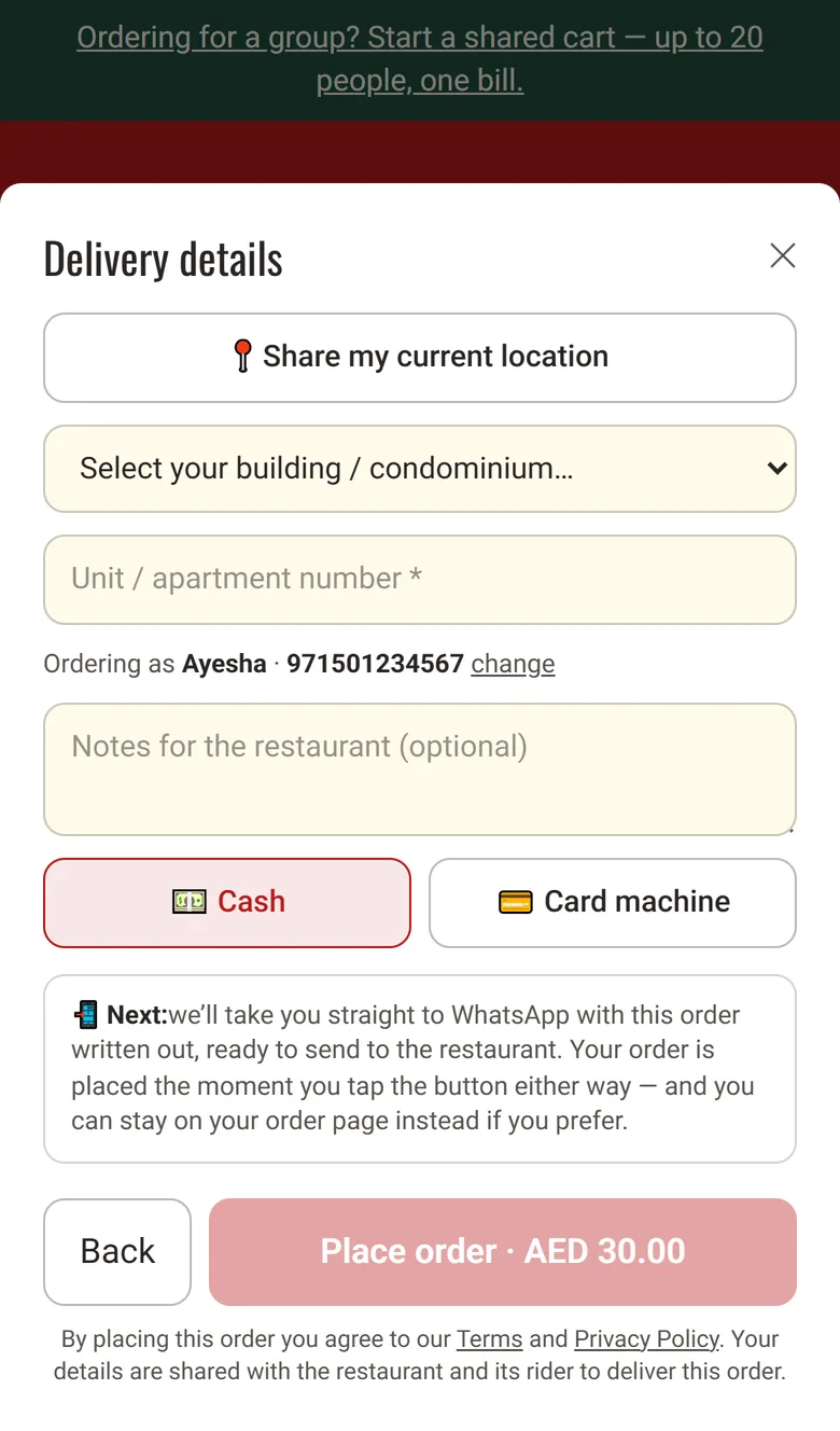 The Delivery details step of a GetMenu checkout on a phone: a Share my current location button, a list to select the building, a unit number field, a notes box, a choice of Cash or Card machine, and a Place order button.