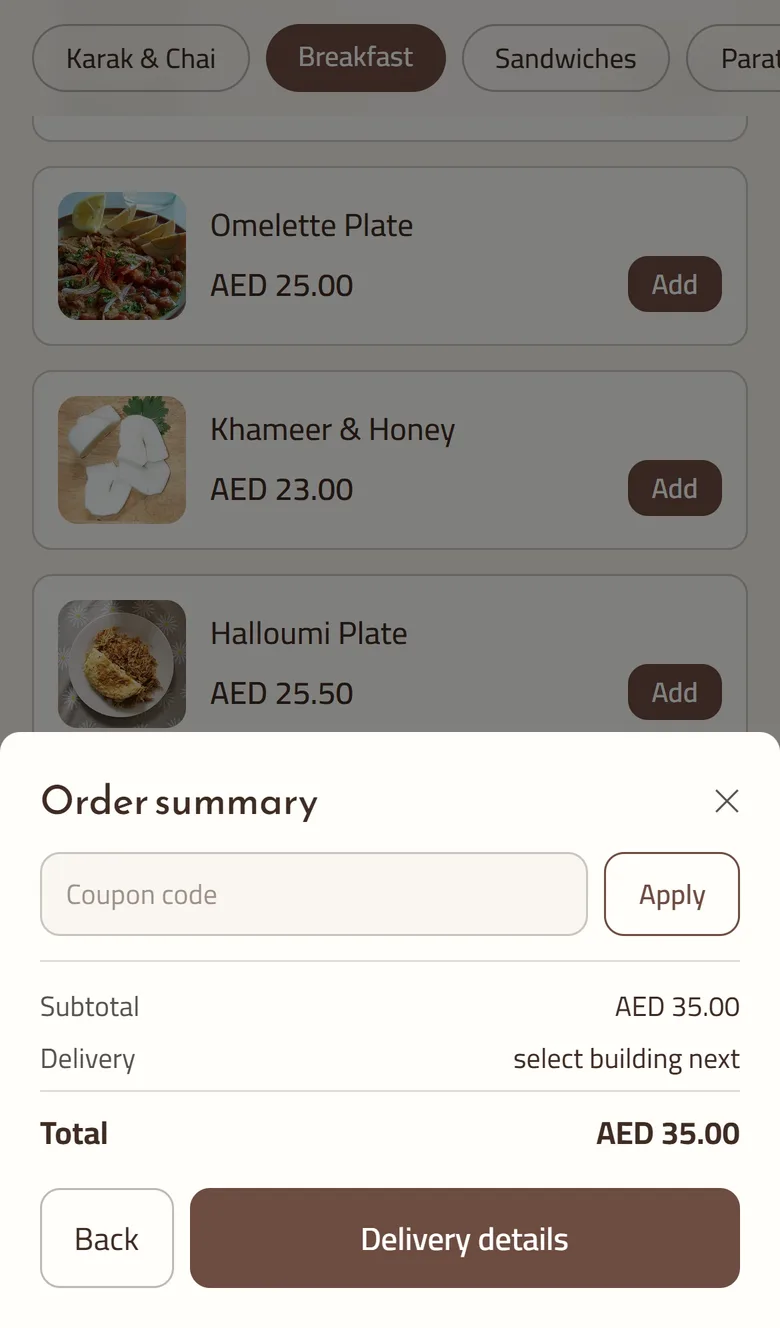 The Order summary step of a GetMenu checkout on a phone, over a menu of breakfast dishes: a coupon code box, the subtotal, a delivery line that reads select building next, the total, and Back and Delivery details buttons.